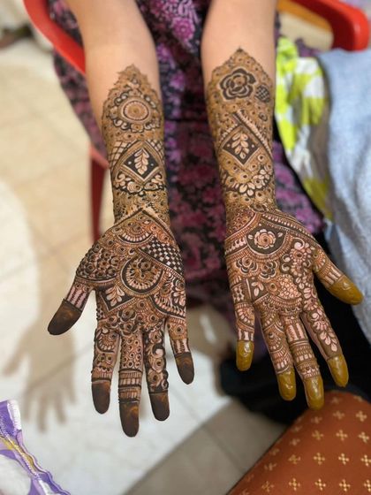 Both hands of the client, showing a symmetrical and beautifully executed design.