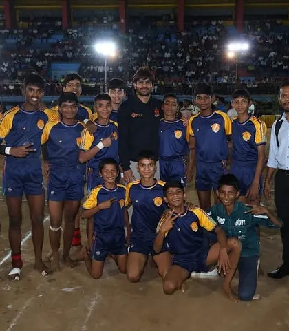 Our junior players on the mat after their win, soaking in the atmosphere of the stadium.