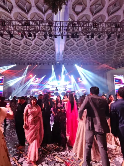 The grand scale of a pre-wedding celebration. From this angle, you can see the impressive lighting rig and the large crowd I'm playing for.