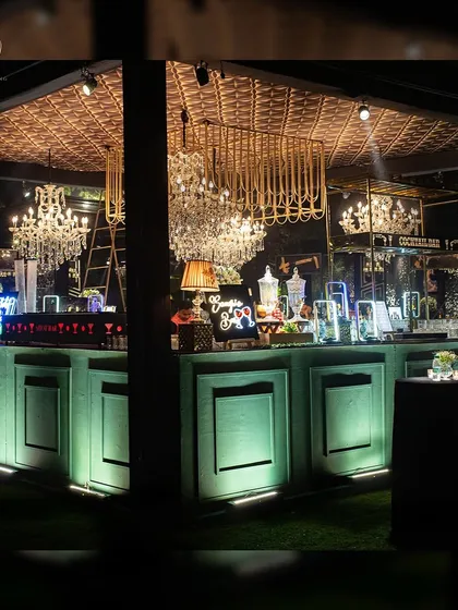 The full view of the grand cocktail bar, featuring a lit facade and an elaborate overhead structure. This is how I turn a functional area into a design statement.