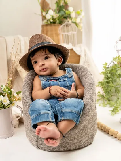 Adding a hat can change the whole vibe of a photo. This little guy looks so dapper and cool during his sitter session.