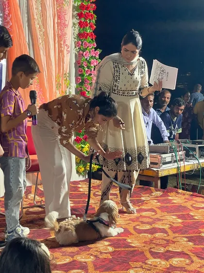 A young participant showing off his Shih Tzu's calm temperament. Events like these are a great way to promote responsible pet ownership in the community.