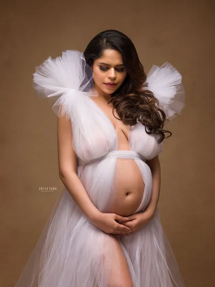 Embracing the miracle of life with an ethereal touch. Using layers of soft white tulle from my studio wardrobe, we created this fine-art portrait that feels like a dream, celebrating the beautiful transformation of motherhood.