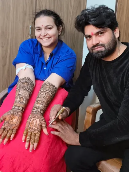 Me with another happy bride. Her smile shows her satisfaction with the detailed portrait mehandi I created for her.