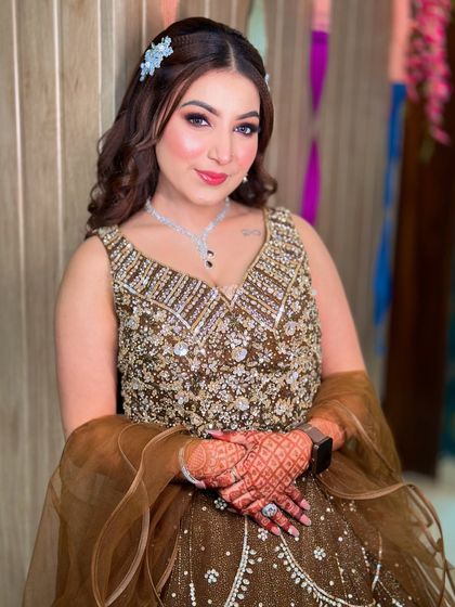 A smiling portrait of Kavya. Her skin looks naturally flawless and glowing.