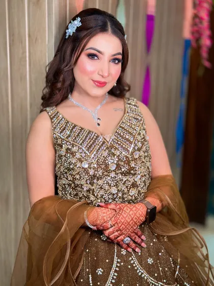 A smiling portrait of Kavya. Her skin looks naturally flawless and glowing.