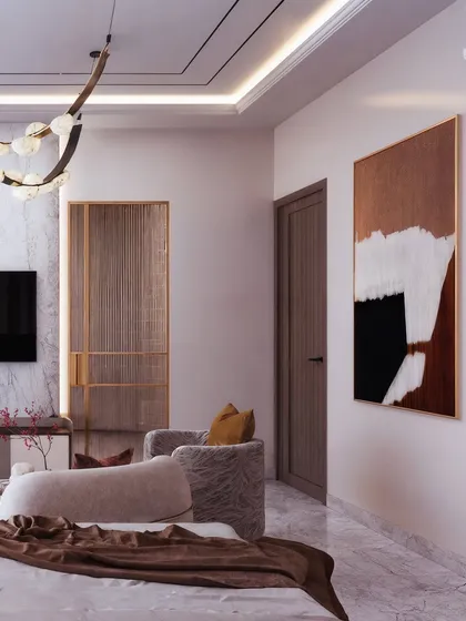 A perspective shot that captures the overall layout of the master bedroom, showing the relationship between the bed, seating area, and TV wall.