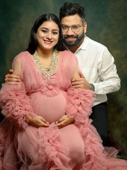 It's baby month! This couple is radiating excitement. The gorgeous pink gown and the happy smiles make this a perfect portrait to celebrate the final stretch.