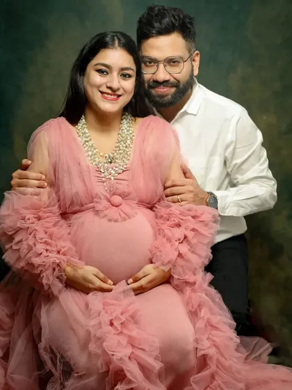 It's baby month! This couple is radiating excitement. The gorgeous pink gown and the happy smiles make this a perfect portrait to celebrate the final stretch.