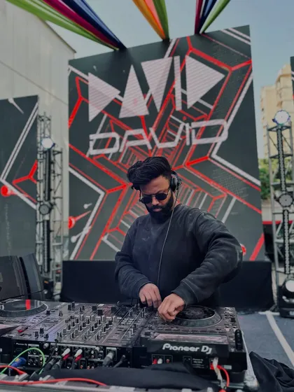 Commanding the stage at a massive Holi festival. My VDJ setup isn't just about music; it's a full visual experience with graphics synced to every beat, making the event truly epic.