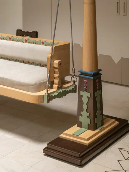 This custom-designed Oonjal, or traditional swing, is the heart of our Kolam Pop project. We reinterpreted classic South Indian temple architecture and Kolam motifs into a modern, playful form. The turned wood posts and colourful, geometric base make it a functional sculpture that brings joy and heritage into the home.
