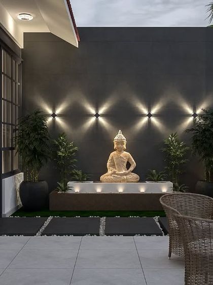 A perspective view of the verandah's meditation corner. The design features a calming Buddha statue set against a dark accent wall with patterned lighting, creating a peaceful focal point for the outdoor space.