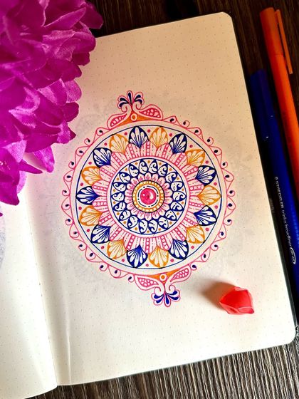 A slightly different angle of this notebook mandala, showing the delicate details and the way the colors fill the page.