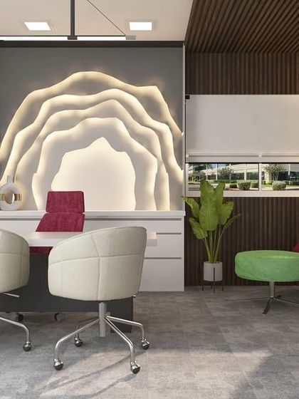 A vibrant and colorful executive cabin with a unique backlit wall feature. The mix of bold colors and textures creates an energetic and creative workspace.