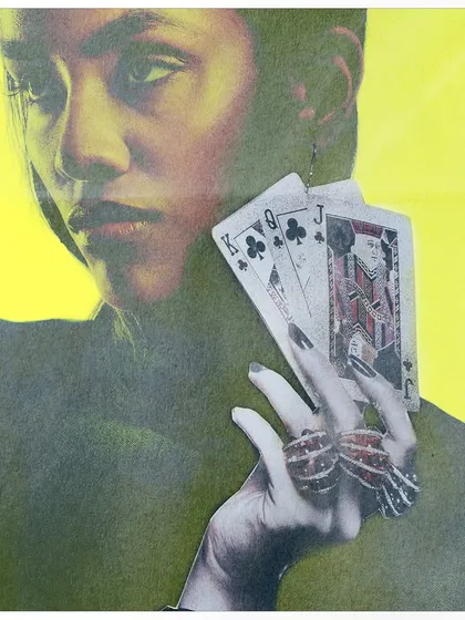 A close-up detail of a collage element, where a hand holding playing cards is superimposed on a portrait. The vibrant yellow background and grainy texture give it a vintage zine feel.