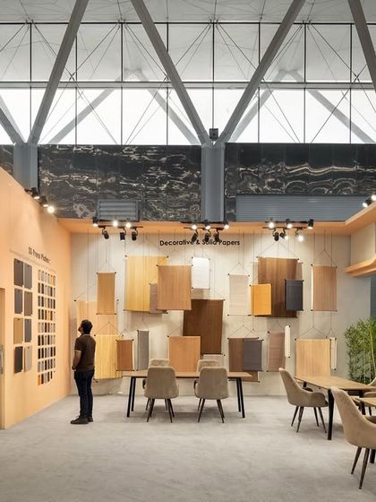 Inside the Ambica exhibition stall, we designed a gallery-like space for displaying decorative and solid papers. The products are hung like works of art, allowing visitors to appreciate the textures and finishes in a calm, curated setting.