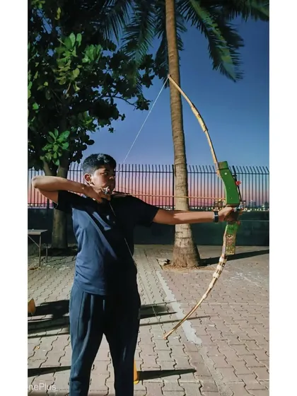 An adult student enjoying an evening session. The calm and focus of archery is a great way to end the day.