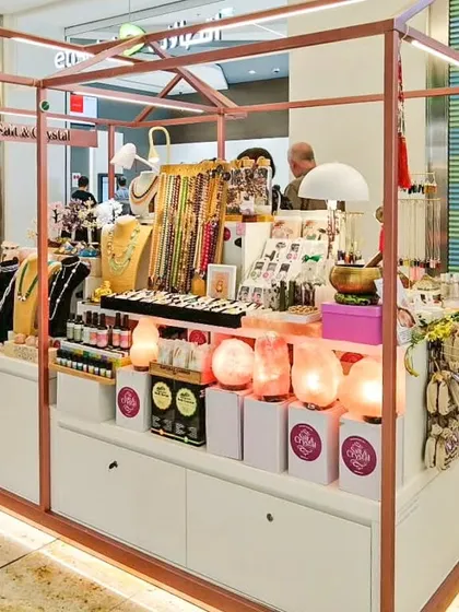 We fabricated this well-lit, professional jewelry kiosk for an exhibition at Seawood Mall. The design includes clean white cabinetry, rose gold framing with integrated LED lighting, and multiple display levels to showcase products effectively.