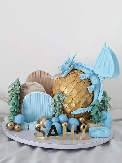 This dragon cake was such an exciting project. It required careful planning to get the structure and details just right, from the individually placed golden scales on the egg to the dragon itself. I love when your ideas push me to try new things.