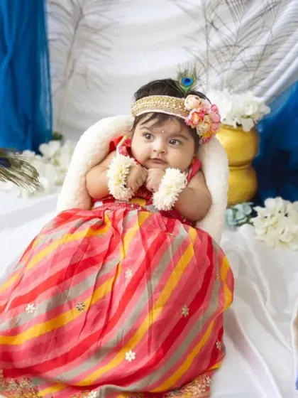 This little goddess is looking so serene and beautiful. The Janmashtami theme is a wonderful way to create culturally rich and timeless family heirlooms.