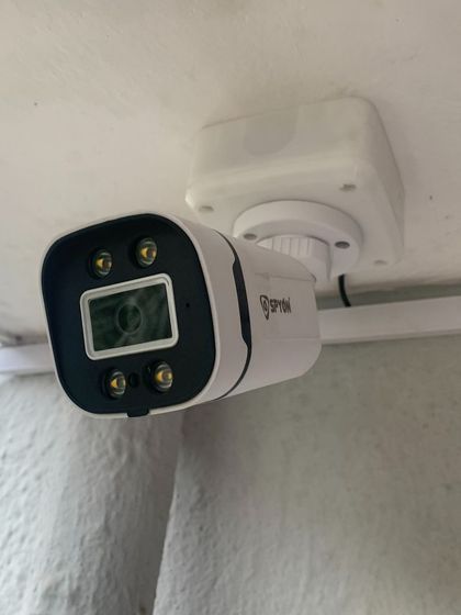 A close-up of a modern outdoor camera, designed to be both effective and discreet.