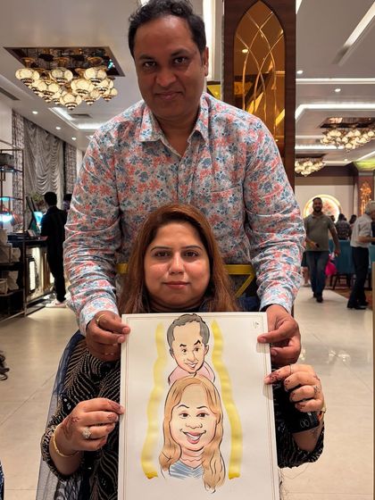 A family caricature capturing a couple and their child, a wonderful keepsake from a party in Jammu.