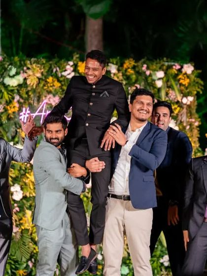 The classic groom lift by his friends. This is always a highlight of the groomsmen's performance and a great photo opportunity.