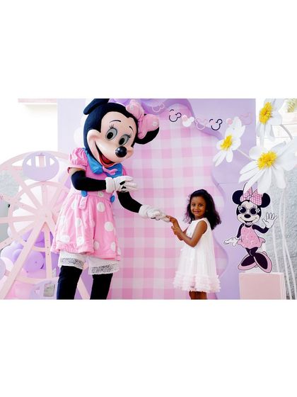 Another angle of the birthday girl and the Minnie Mouse mascot, showing the fun and interactive experience we create.