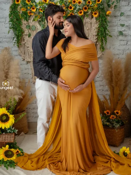 We love capturing the connection between expecting parents. This couple's maternity shoot features our popular boho-chic setup with sunflowers and macrame, creating a warm and intimate portrait.