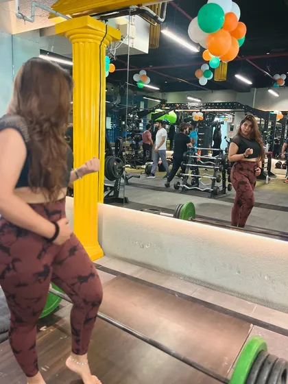 Checking my form in the mirror. Proper technique is everything for getting results and preventing injury.