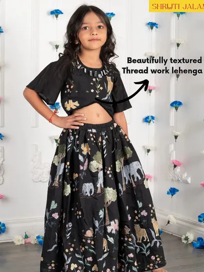 A close-up of the beautifully textured thread work on my black jungle-print lehenga. The detail is what makes these outfits stand out.
