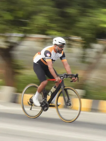 A rider in motion, celebrating World Bicycle Day. For us, every day is bicycle day, but we love to celebrate the joy that cycling brings to our lives.