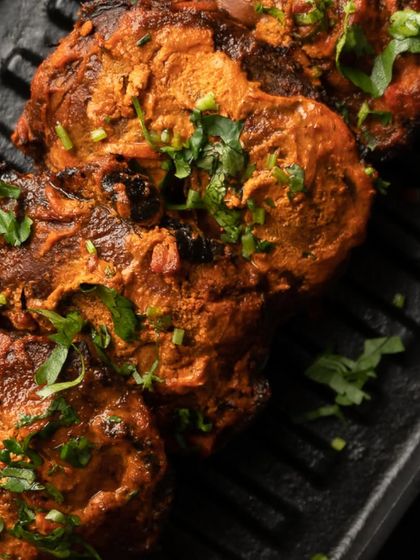 My Tandoori Mushroom Tikka is a tantalizing twist on a classic. Button mushrooms are stuffed with spiced cottage cheese and grilled to a crispy exterior.