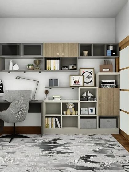 We designed this home office with a full wall of custom storage. The unit combines open shelving, closed cabinets, and a spacious L-shaped desk, providing a comprehensive and organized solution for anyone working from home.