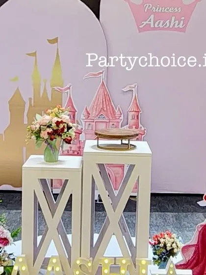 A close-up of the princess castle theme, showing the elegant backdrop and Ariel cutout before the full balloon arch was added.