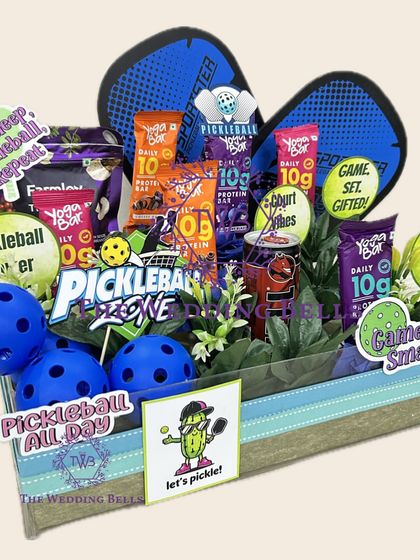 A closer look at the details of our sporty Pickleball Rakhi hamper. We've included fun, quirky stickers and all the essentials for a health-conscious sibling who loves a good match.