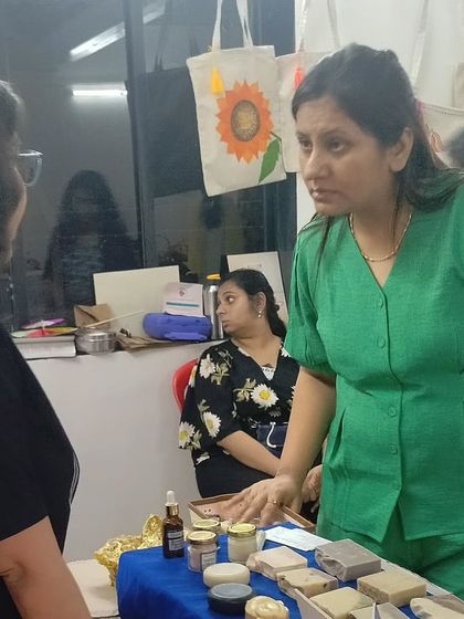 Deep in conversation with a customer, explaining the benefits of my handmade products.