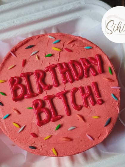 Say it with personality. This bold pink bento cake with "Birthday Bitch!" in vibrant red lettering and colorful sprinkles is perfect for a fun and unapologetic celebration.