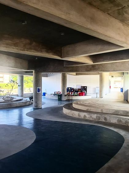 The ground floor of an institutional building, showing the expressive potential of raw concrete and the fluid forms that can be achieved with it.