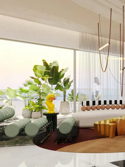 The living area is filled with natural light from floor-to-ceiling windows, highlighting the collection of unique furniture pieces and the vibrant color palette.
