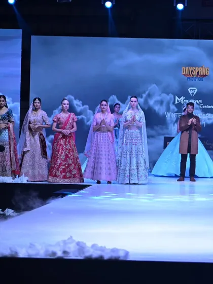 Another view of the final runway lineup, capturing the grandeur and scale of the GULFAM collection showcase.