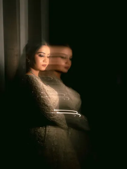 A long exposure shot with light trails, adding a dynamic and creative element to this bridal portrait.