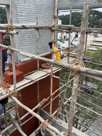 A series showing masons meticulously laying bricks for a facade. Achieving a perfect finish requires incredible skill and patience, and we have immense respect for the craftspeople who bring our designs to life.