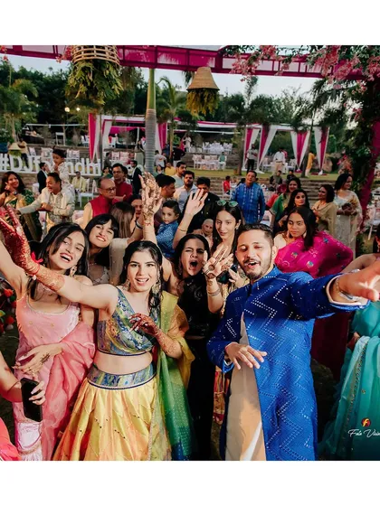 A happy group photo from Geet and Dheemant's Mehendi. We make sure to capture the couple celebrating with their closest friends and family, the 'bride tribe' and 'groom squad'.