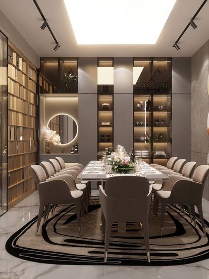 A dining space that is cozy, comfortable, and undeniably luxurious. Designed for a large family in Rohtak, this room features a 12-seater table, dramatic wall art, and sophisticated lighting to host grand dinners in an intimate setting.