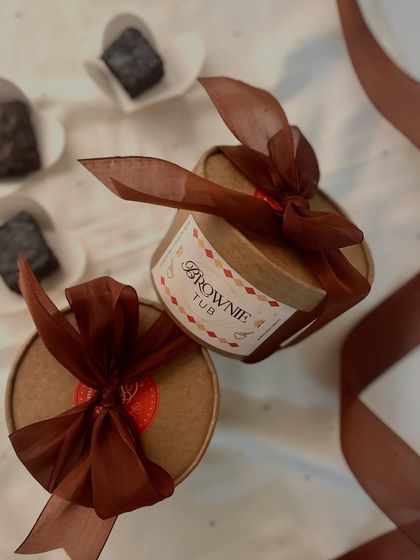 Introducing our fudgy brownie tubs. Each tub contains bite-sized pieces of our eggless brownies drenched in a rich chocolate sauce for an irresistible dessert experience.