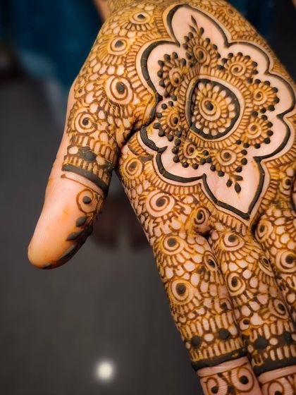 An extreme close-up of the palm mandala, highlighting the precision of the dots and lines.