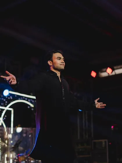 A portrait of the groom in his element, channeling his inner Bollywood hero during his solo dance.