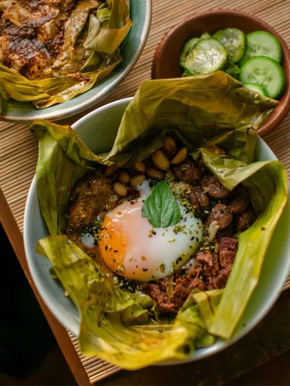 A signature dish from The Second House, Goa pop-up: a comforting rice bowl wrapped in a banana leaf, topped with a perfectly cooked egg.