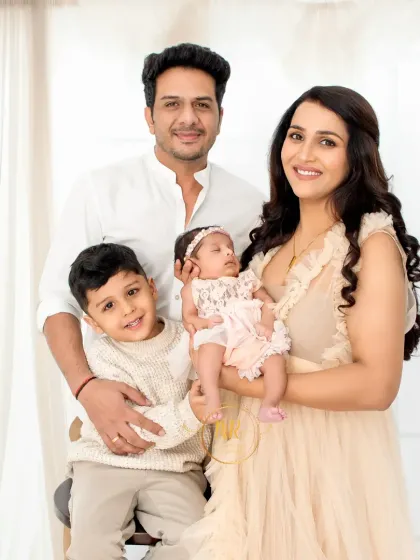 A classic family portrait with a newborn and an older sibling. I guide the family into comfortable poses that feel natural and look beautiful.